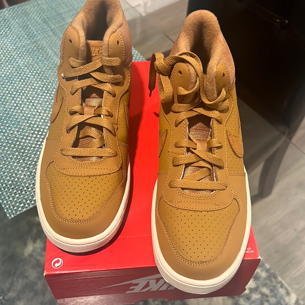 Brand new never worn Nike Court Borough Mid size 7Y and 8.5 in Womens size.